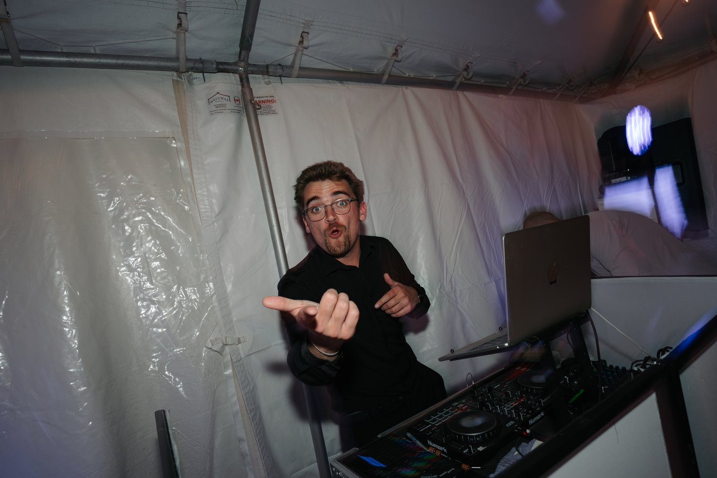 Ryan Dumais behind the DJ booth